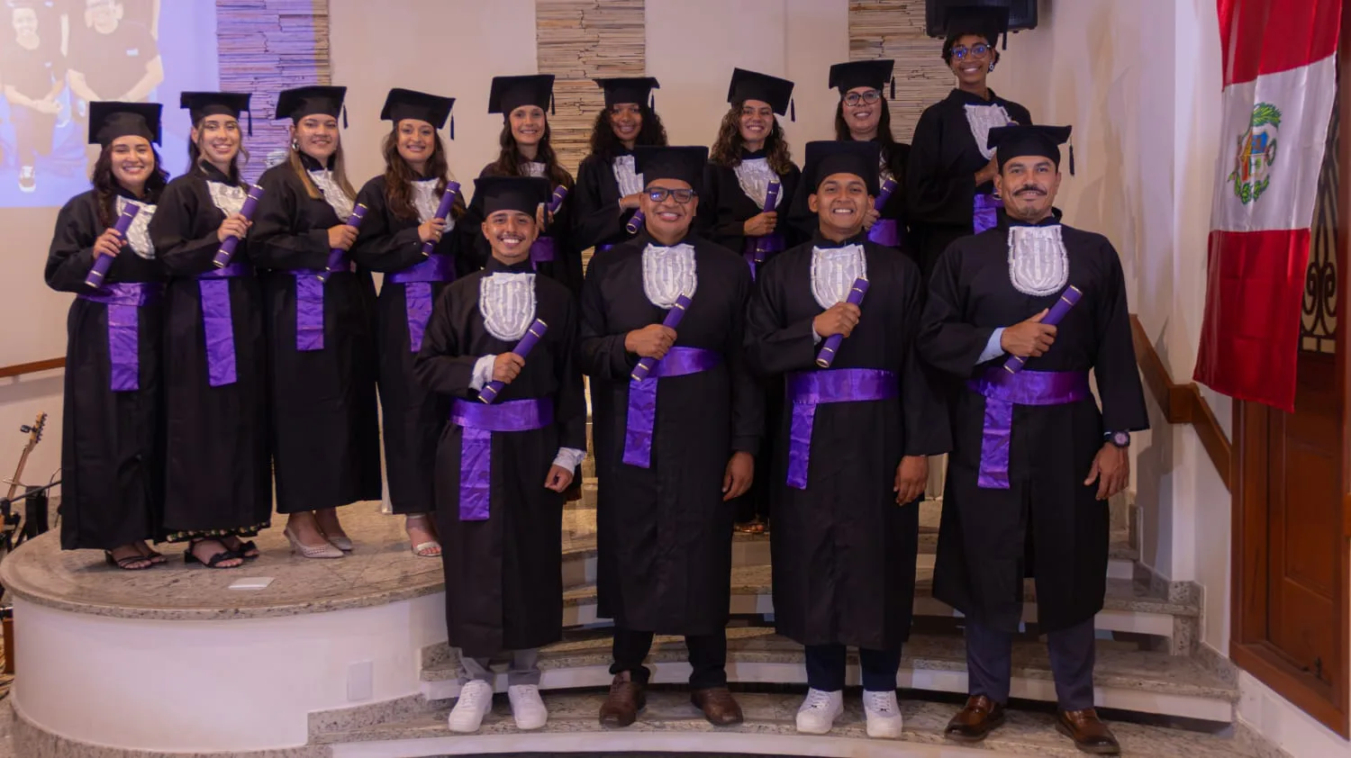 Graduates of MIRC Brasil's missionary training school holding their certificates